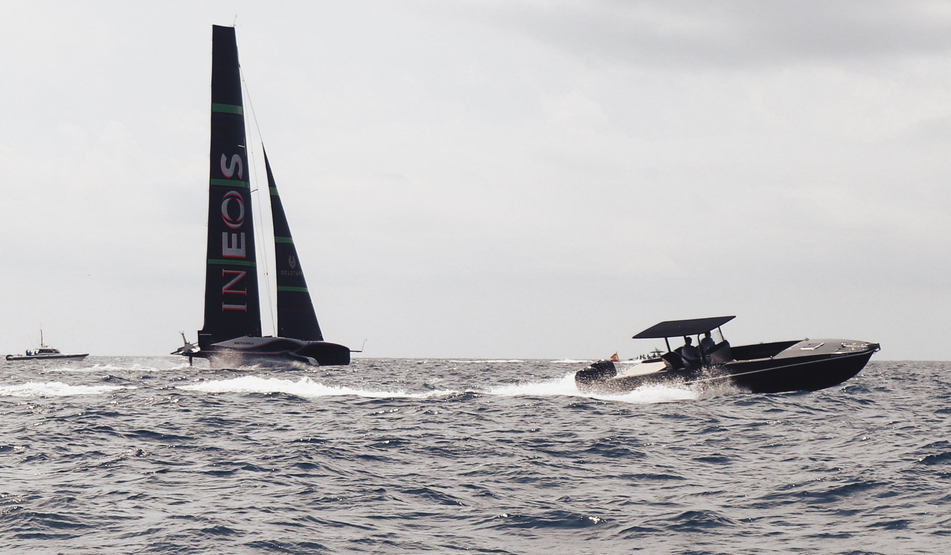 Silhouette of the F11 powerboat with the INEOS yacht on the horizon