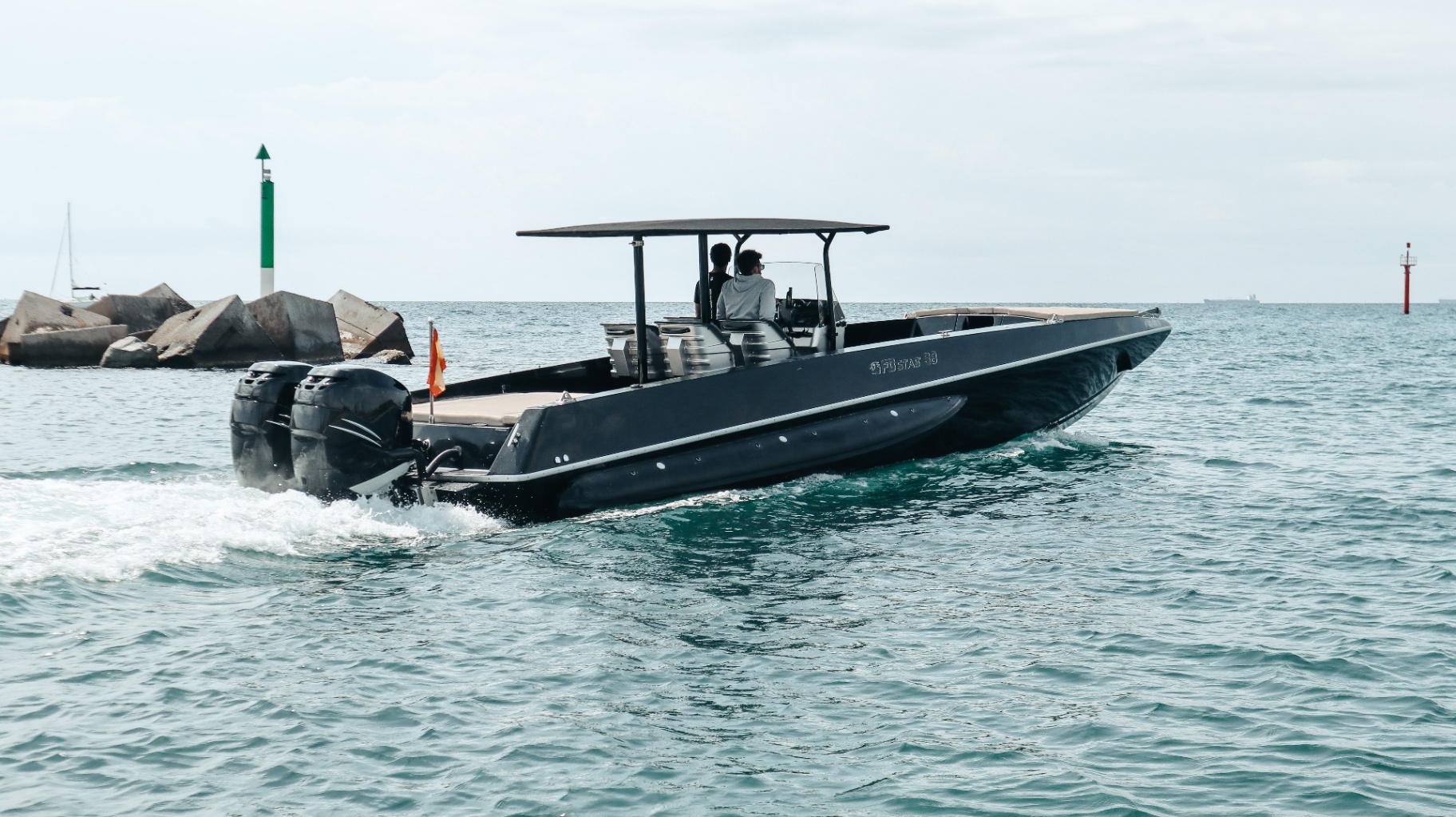 F11 Buzzi running offshore from Barcelona with twin Mercury outboards