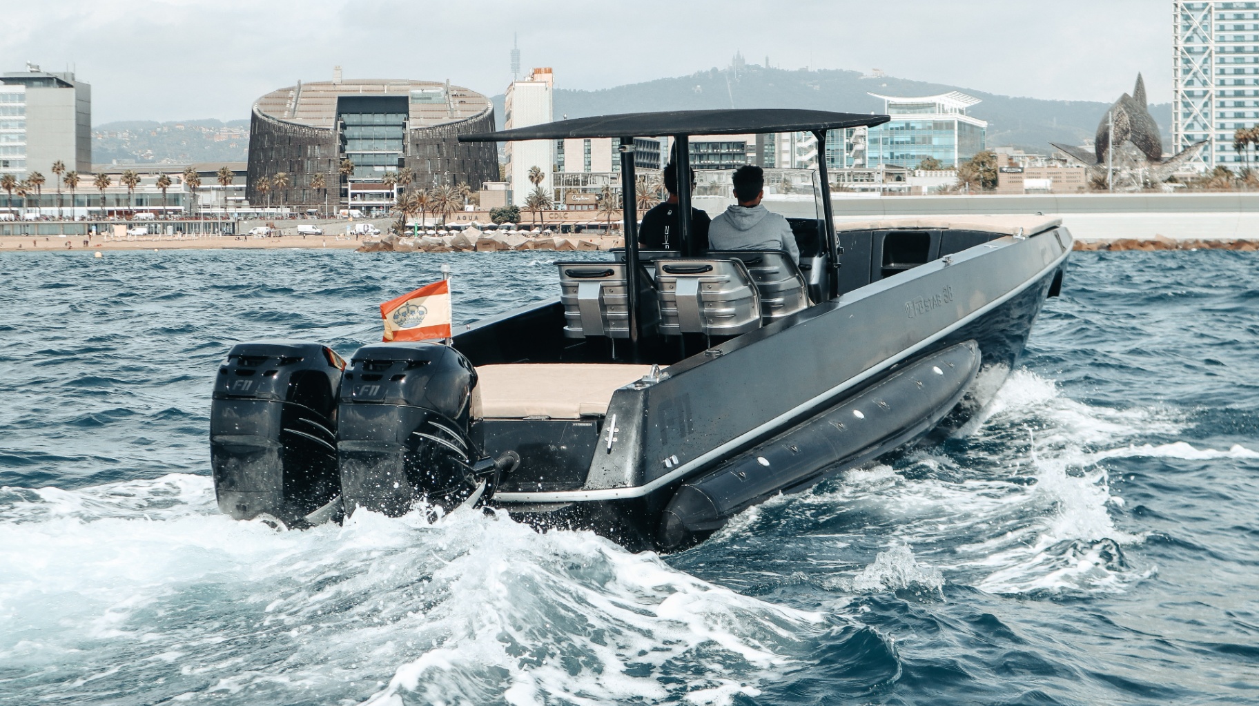 F11 leaving Port Olímpic Barcelona, twin Mercury F11 cowlings