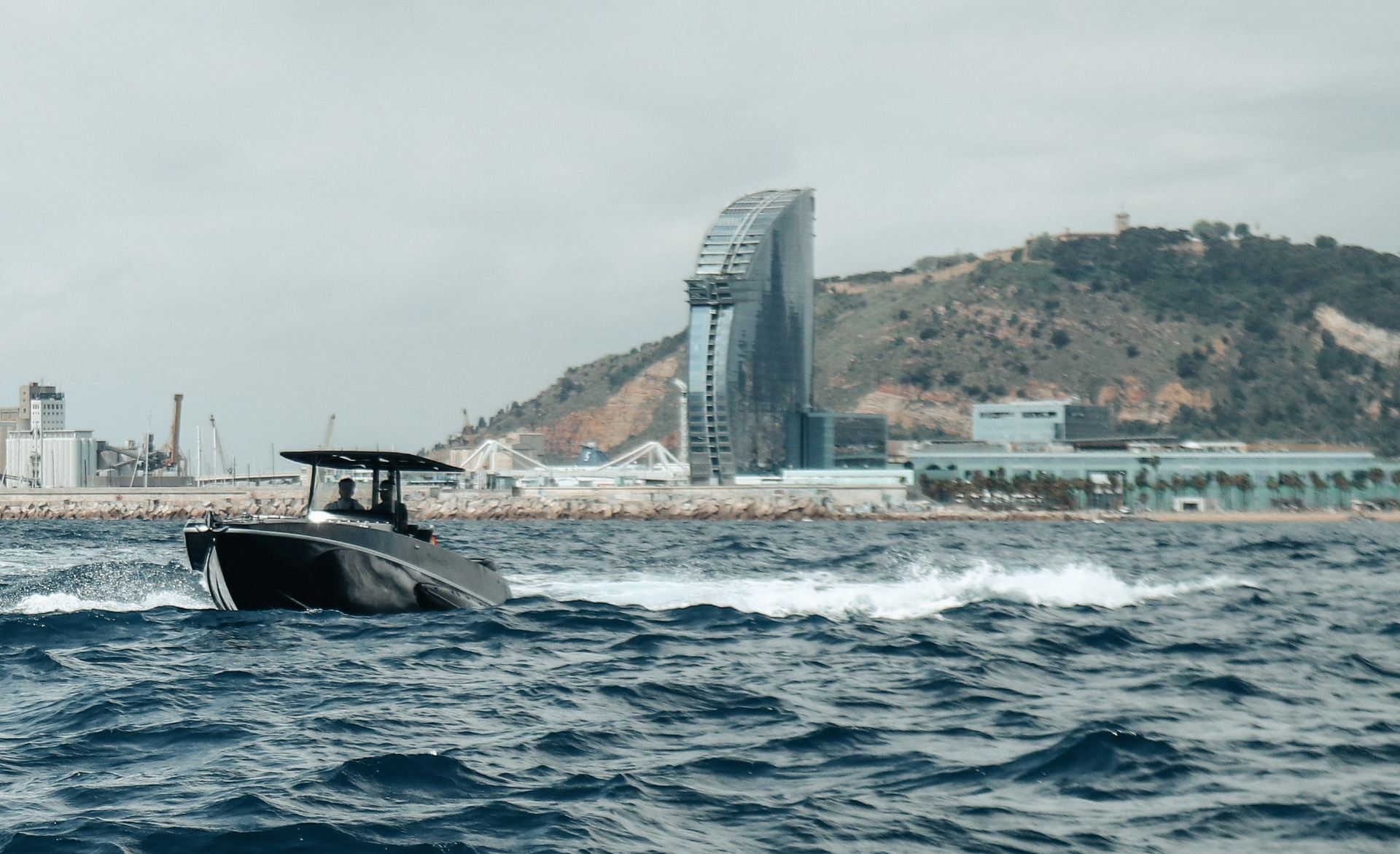 F11 cruising past the W Barcelona skyline