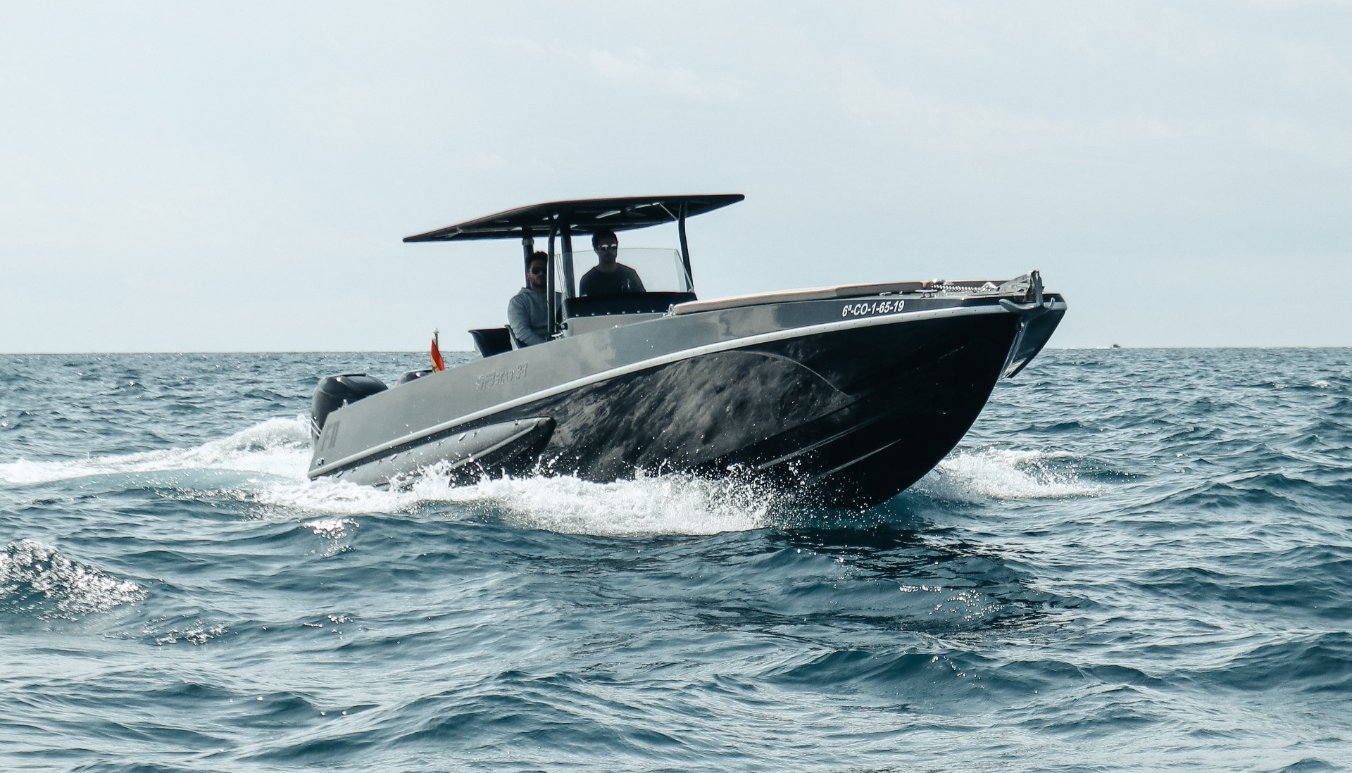 F11 carving a turn off Barcelona, FB Design 38 hull on edge